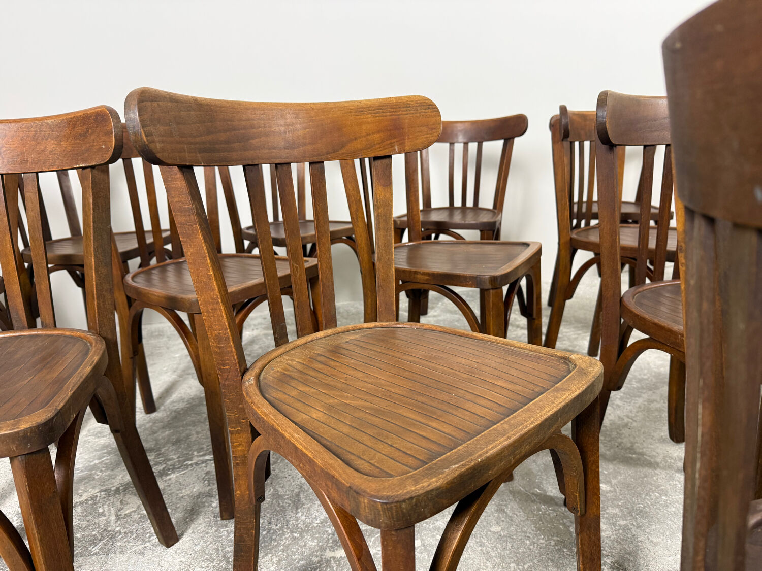 Set of 17 vintage bistro chairs in curved wood — striped seat, be