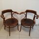 Pair of curved wooden armchairs