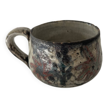 Handcrafted mug with floral decoration