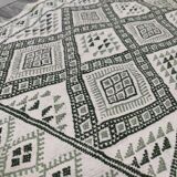 Handwoven white and green rug