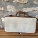 Old set of wooden balls in his suitcase