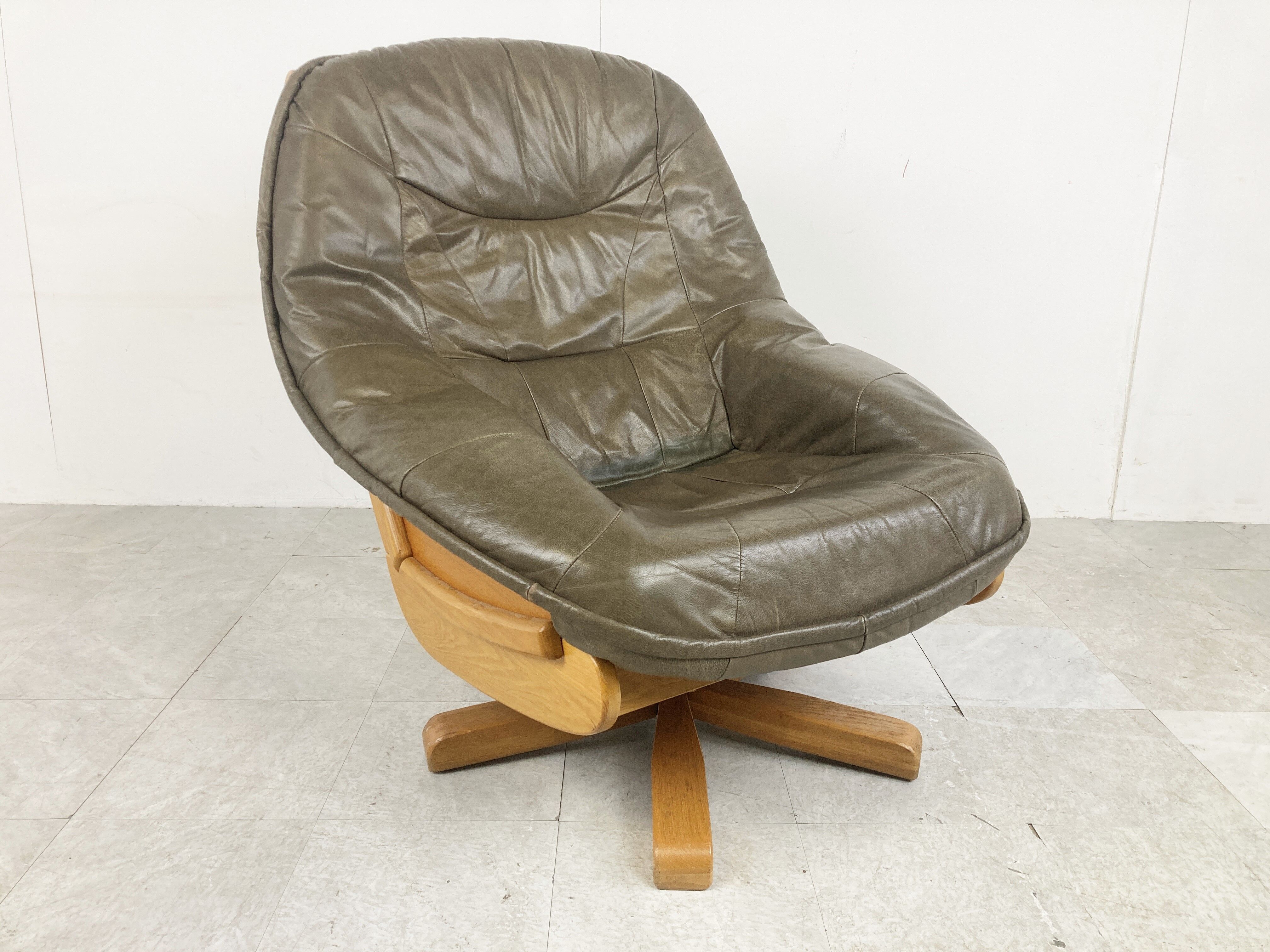 Brutalist oak and leather swivel chair, 1970s