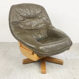 Brutalist oak and leather swivel chair, 1970s