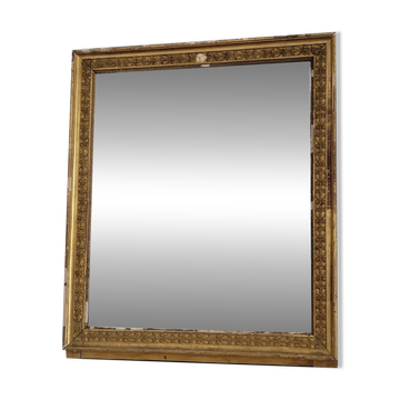 Golden stucco and wood Empire mirror