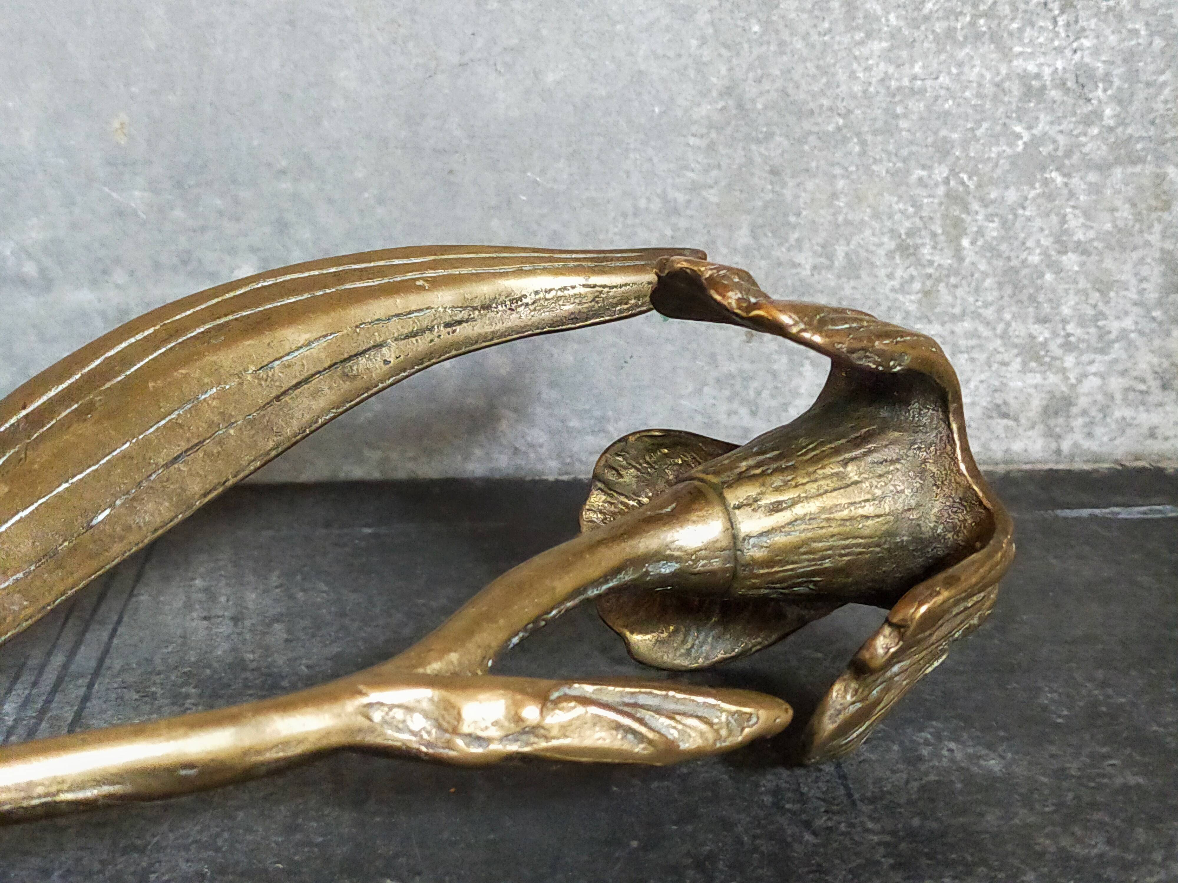 Old iris flower candle holder in solid brass