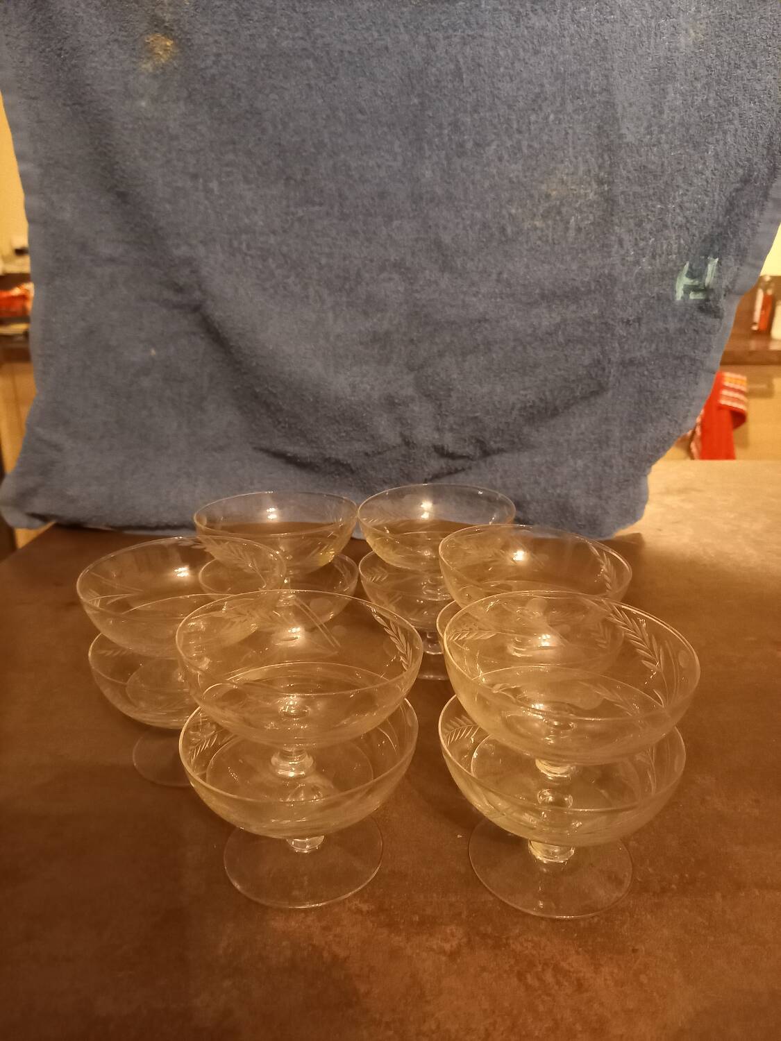 12 crystal champagne glasses engraved with a wheat stalk motif