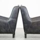 Set of 2 black cow leather armchairs finished with decorative nails, industrial style