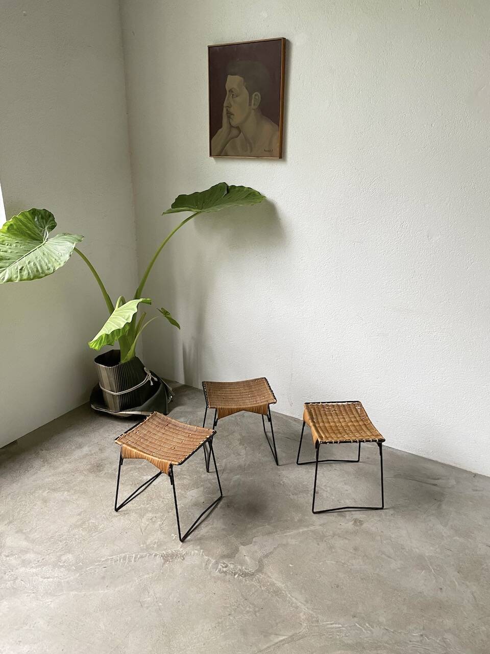 Set of three Raoul Guys wicker and metal stools