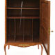 In-between furniture in marquetry decorated with a trophy decoration of musical instruments