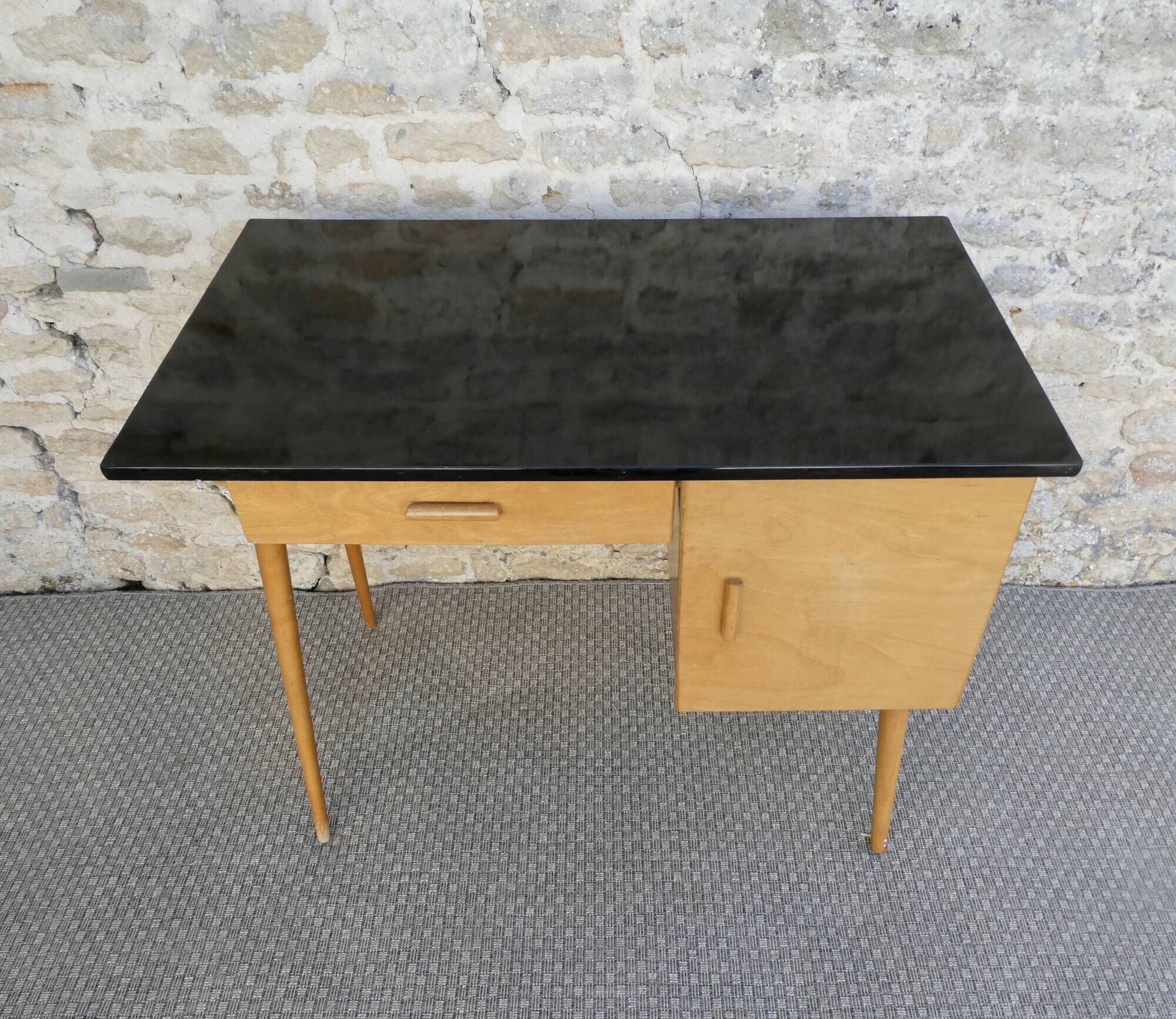 Baumann desk in light wood and black Formica, around 1960.
