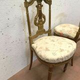 Paire de chaises de style Louis XVI en bois doré XX siècle