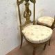 Paire de chaises de style Louis XVI en bois doré XX siècle