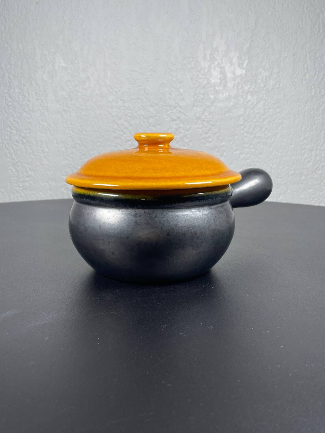 Black and yellow fondue pot