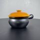 Black and yellow fondue pot