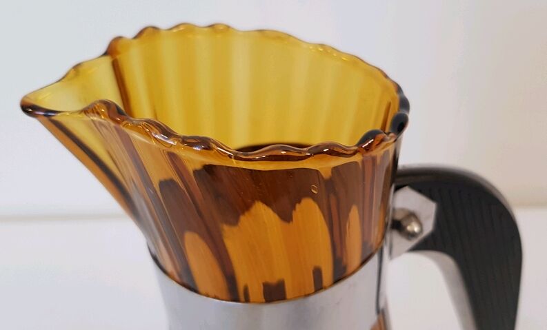 Pitcher blown amber glass and bakelite and aluminum handle and set of stainless