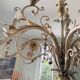 Lustre à bougies en fer forgé avec fleurs