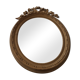 Old oval wooden mirror, surmounted by a knot
