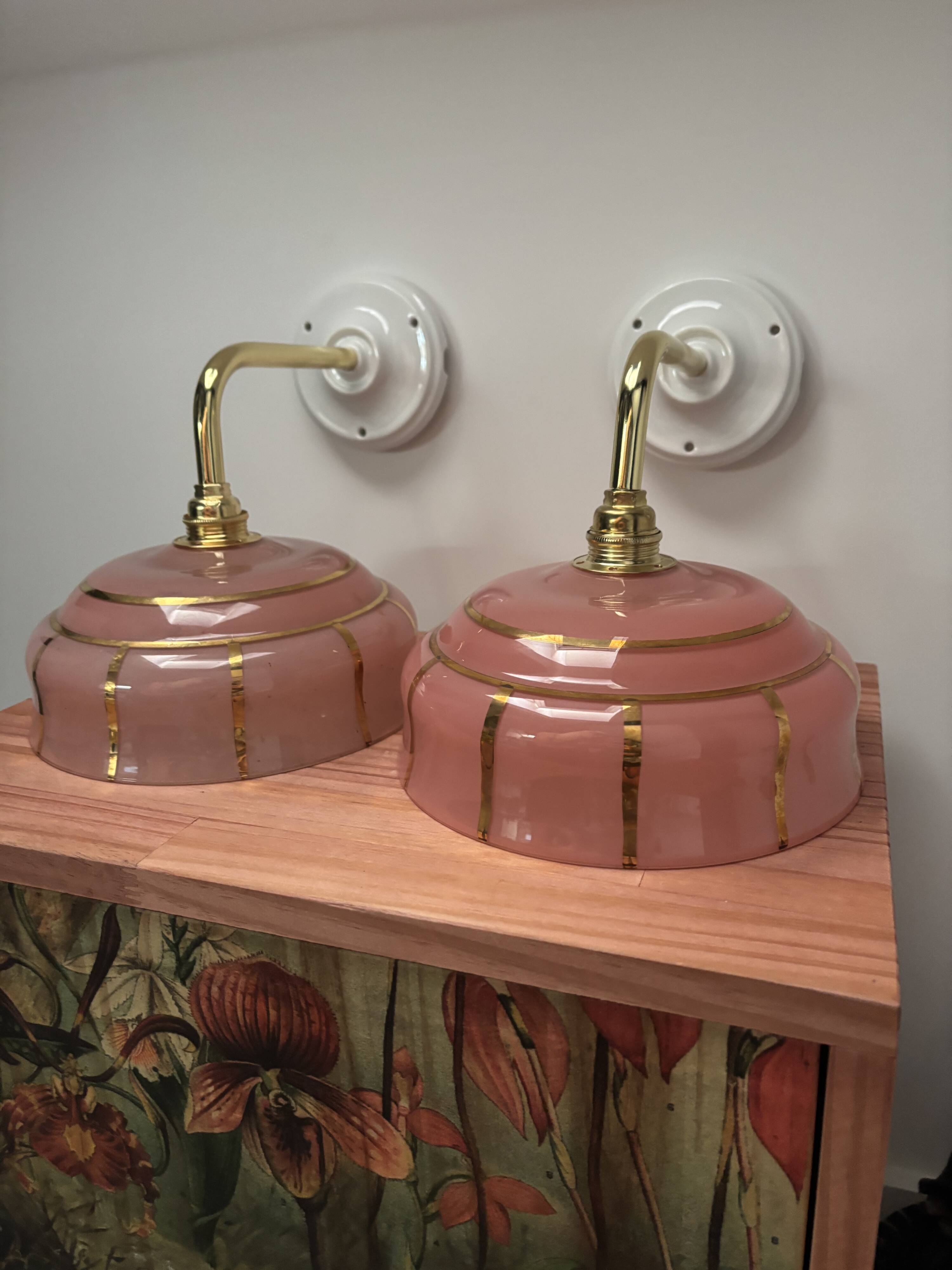 Pair of white ceramic wall lights with pink glass
