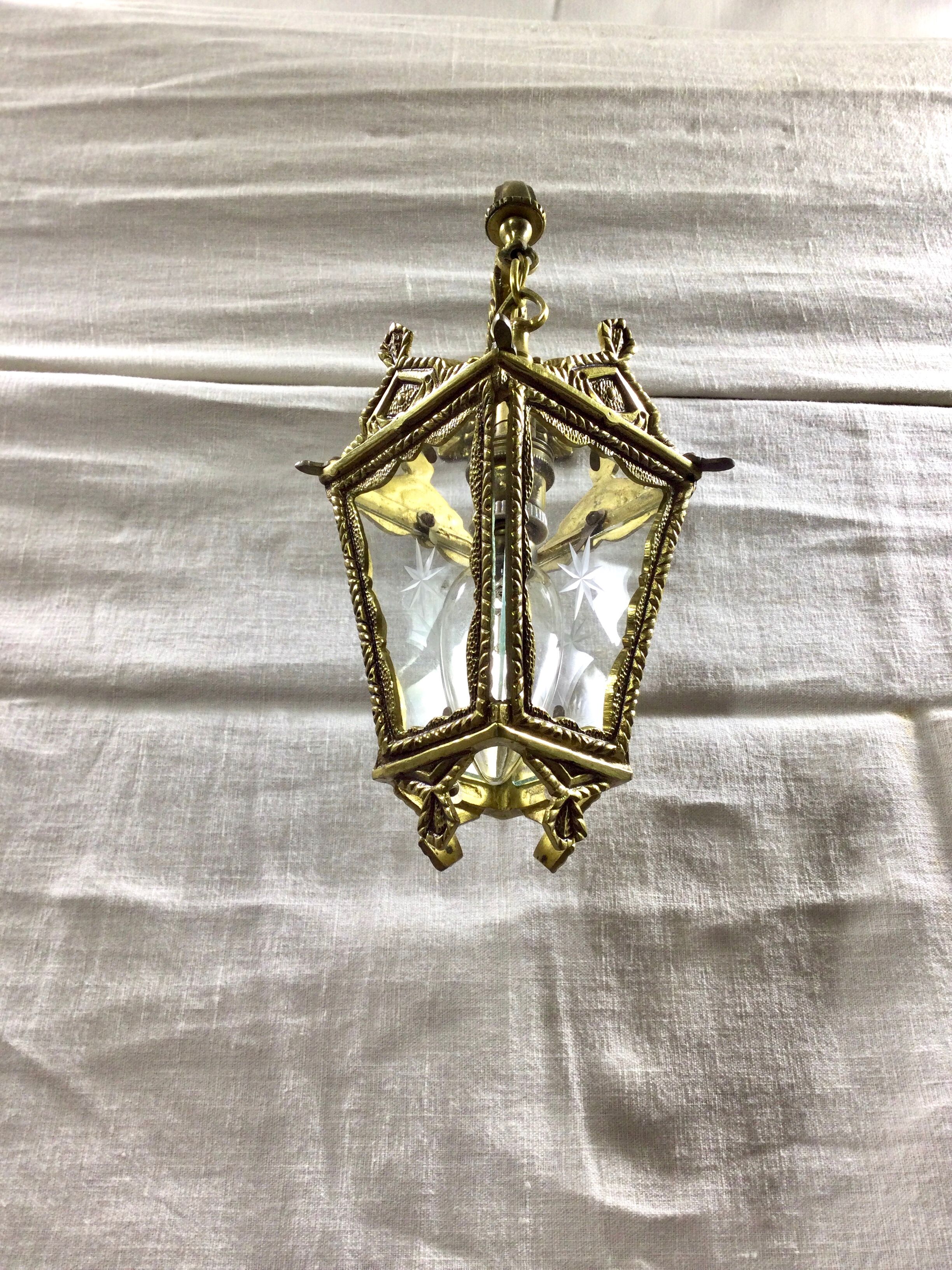 Bronze lantern with starry glasses