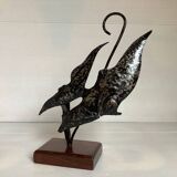 Small metal and wood fish statue