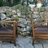 Pair of armchairs in stained wood and leather, 20th century