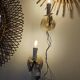 Pair of cream patinated metal wall sconces with floral decoration.