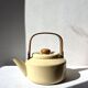 Vintage enamelled metal kettle in beige, Copco style.