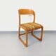 Vintage sled chair by Baumann in wood and wool fabric.