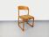 Vintage sled chair by Baumann in wood and wool fabric.