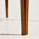 Coffee table in walnut with a ceramic top.