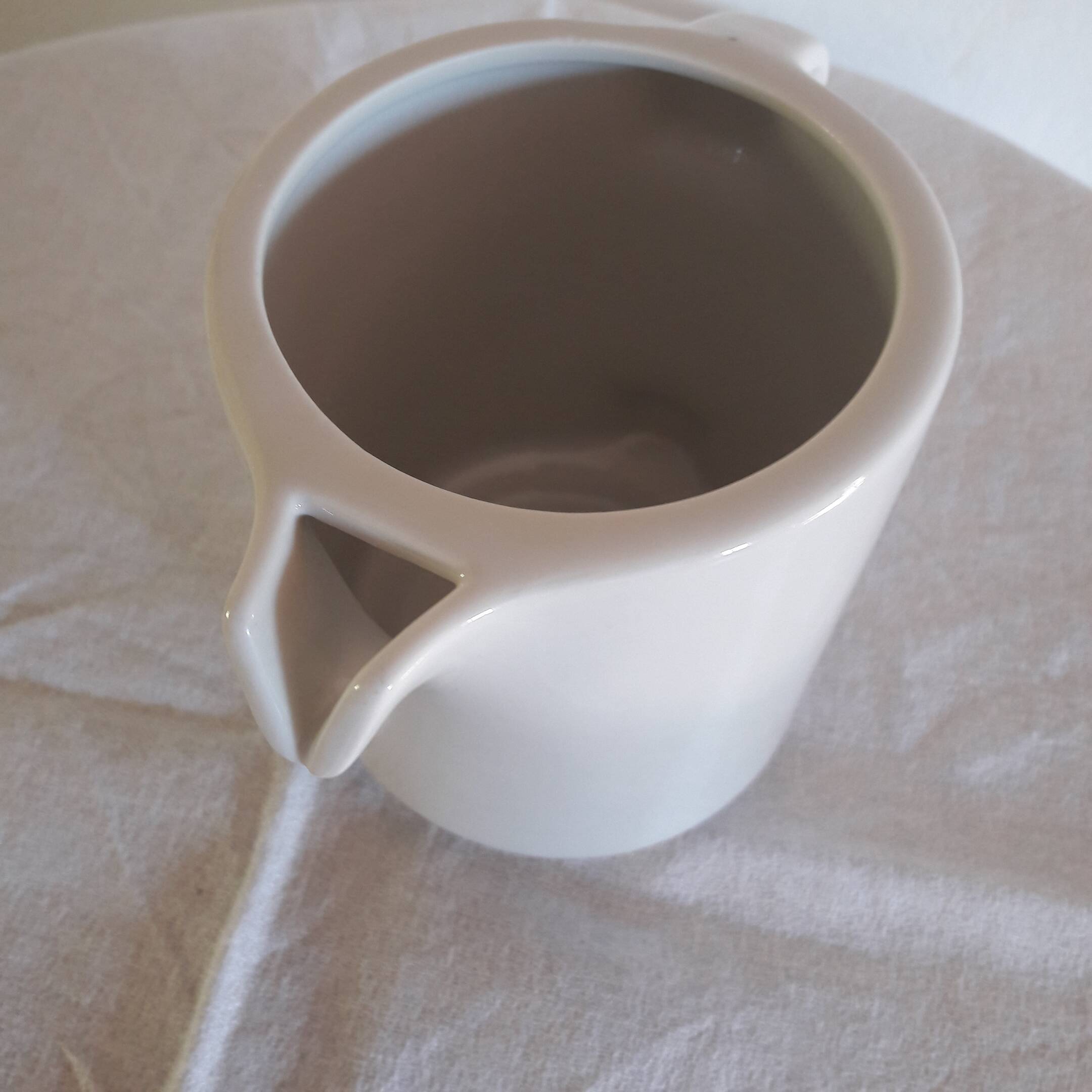 Large white porcelain milk jug