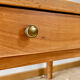 Antique coffee table in solid elm with turned legs.