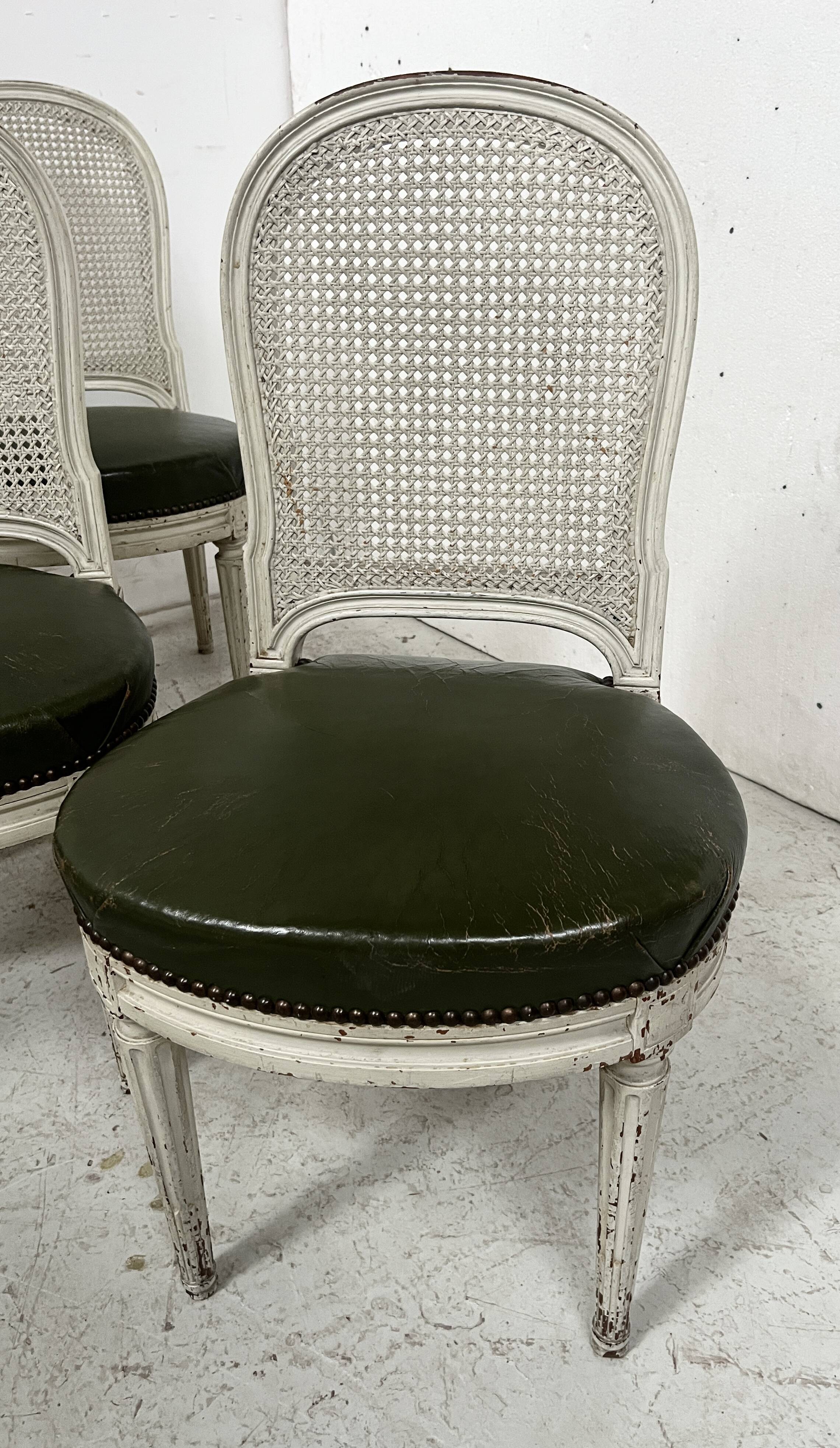 Set of seven Louis XVI style chairs in patinated beech, 20th century.