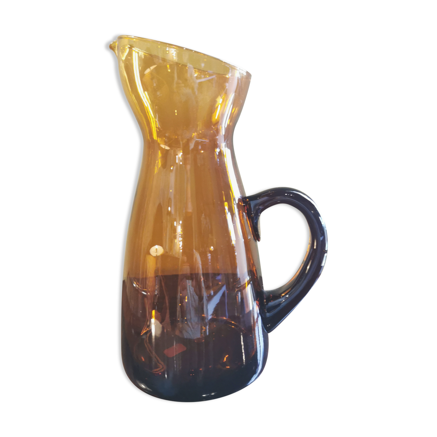 Vintage pitcher in amber glass
