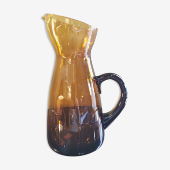 Vintage pitcher in amber glass