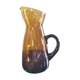 Vintage pitcher in amber glass