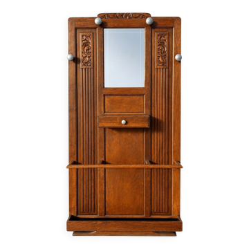 Vestiaire Art déco en chêne massif sculpté et miroir biseauté 1930