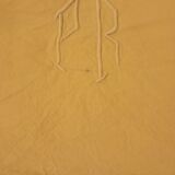 Ancient drapery embroidered initials