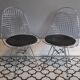 Chaises design en métal chromé et assise en skai noir