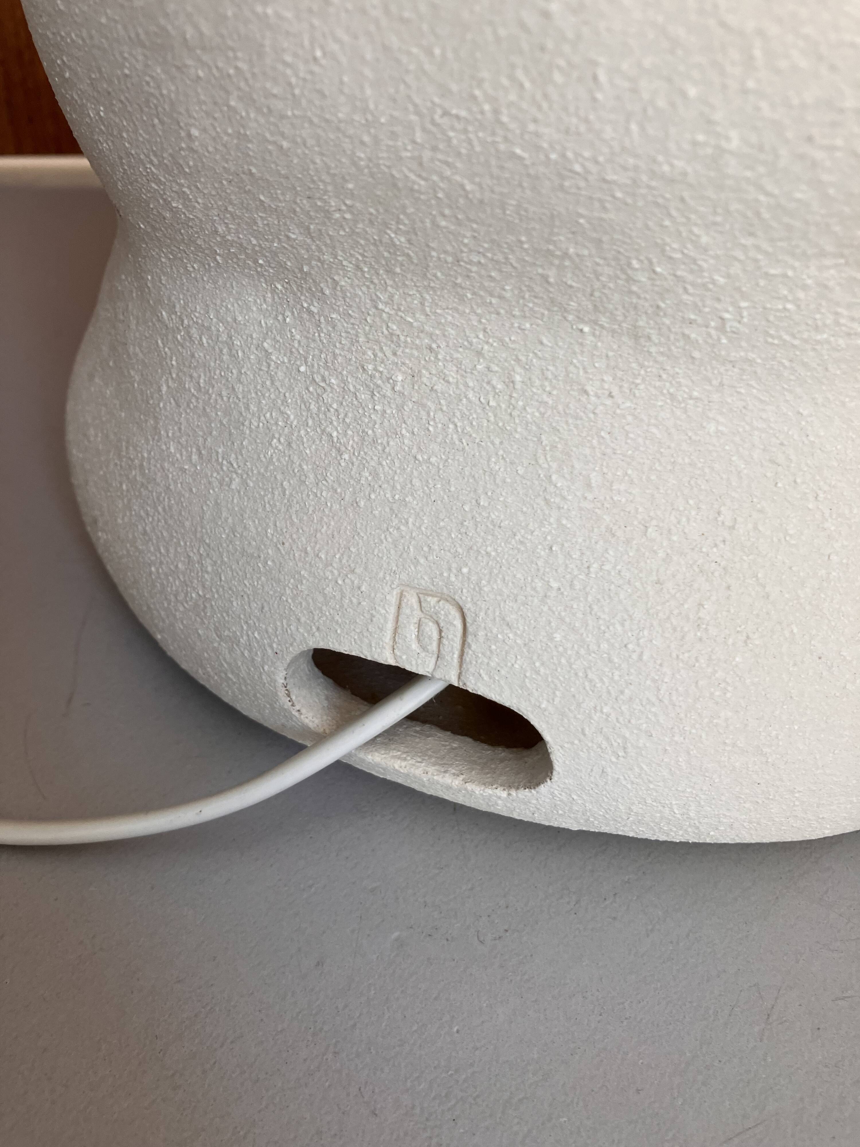 Large table lamp in off-white ceramic with an organic globe shape.