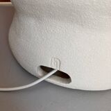 Large table lamp in off-white ceramic with an organic globe shape.