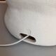 Large table lamp in off-white ceramic with an organic globe shape.