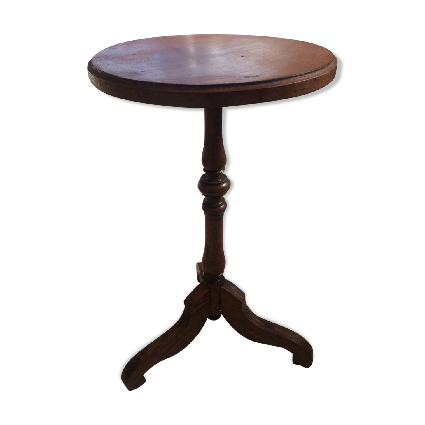 Round end table with tripod mast. 50 years. Medium oak color.