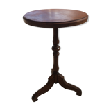 Round end table with tripod mast. 50 years. Medium oak color.