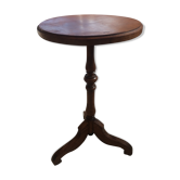 Round end table with tripod mast. 50 years. Medium oak color.
