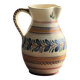 Beige carafe with stylized blue flower friezes