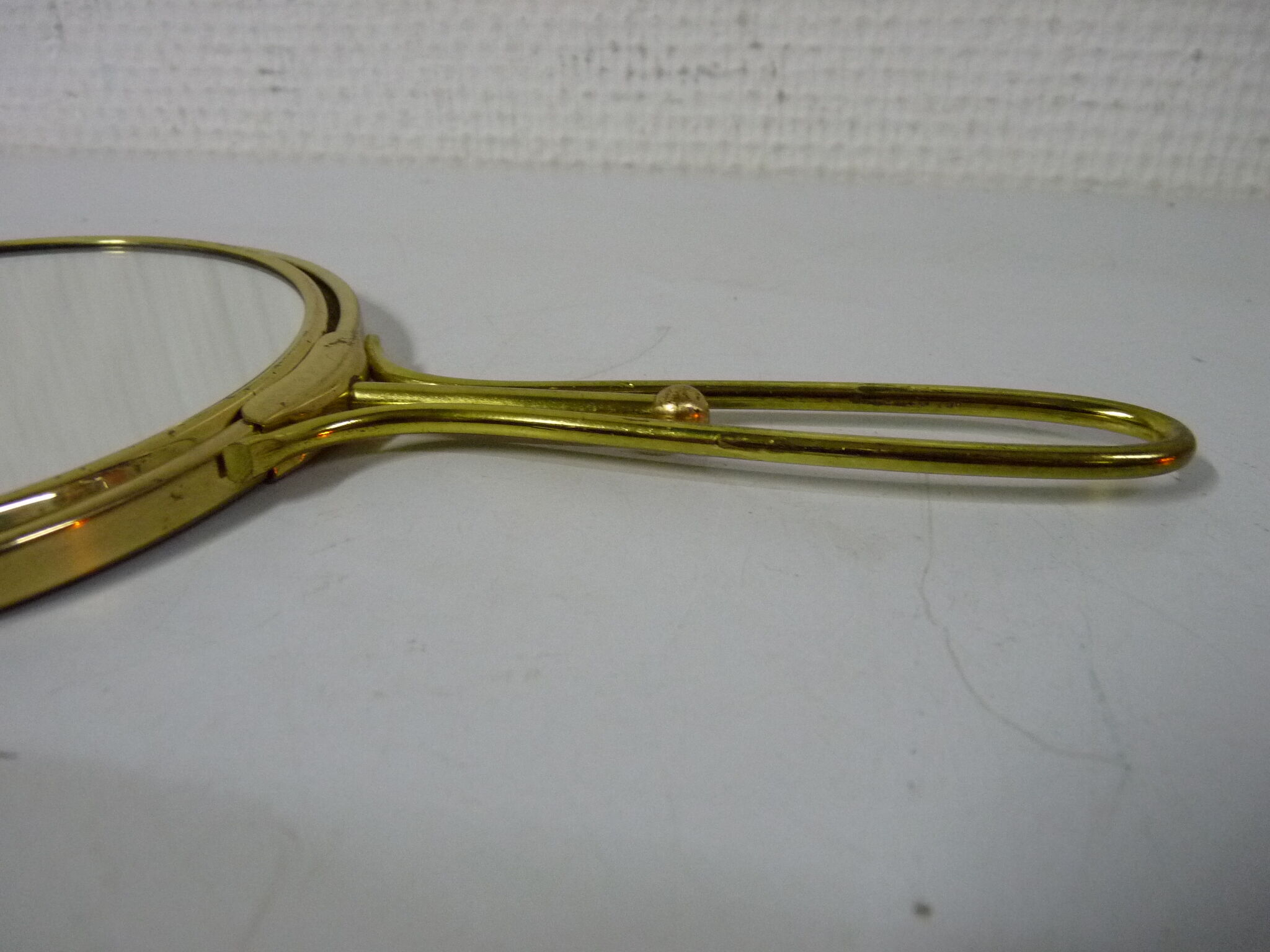 Old mirror double face with golden hand