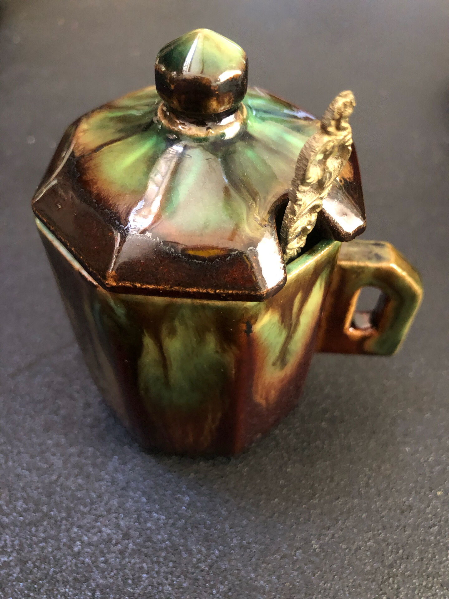 Large service in green and brown glazed stoneware with facets, signed Louis Cag.