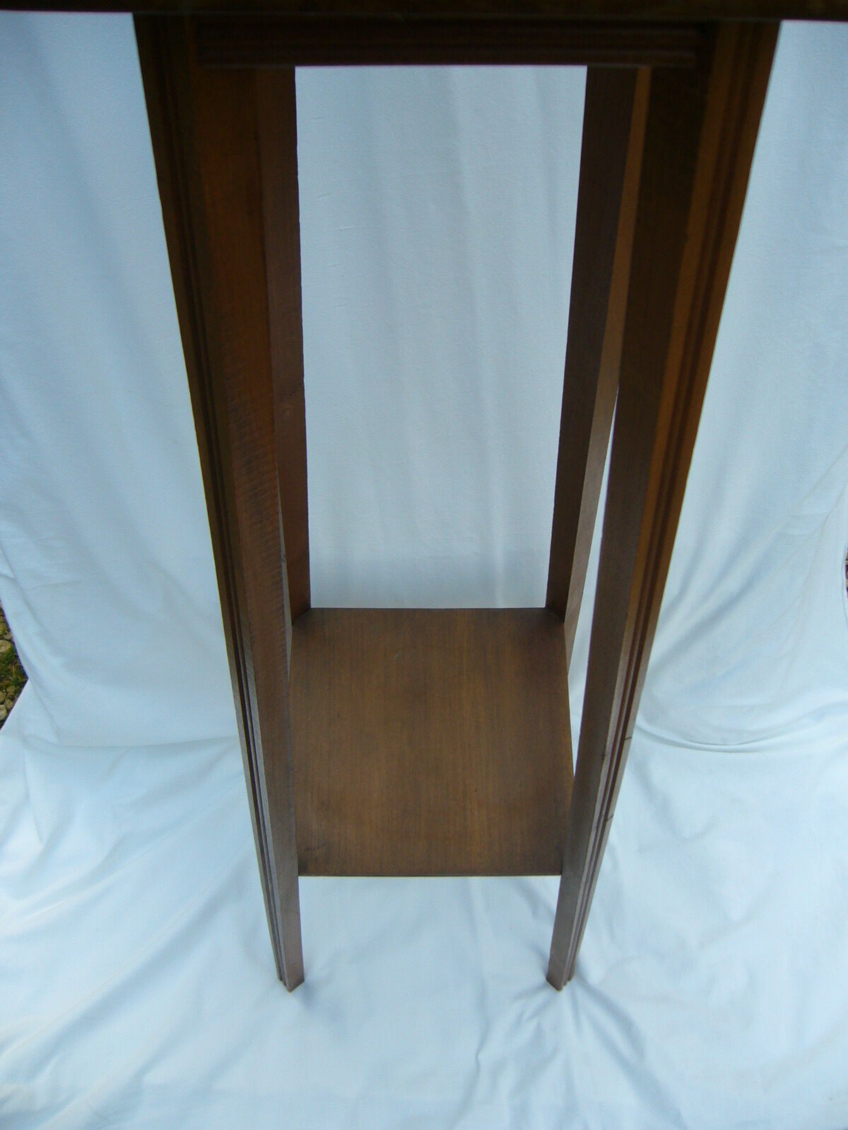 Art deco side table in varnished wood