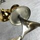 Pair of silver and gold metal candlesticks